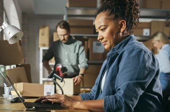 Woman sitting and working at her desk