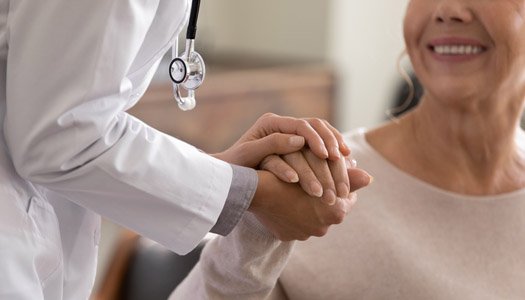 Provider holding a patients hand