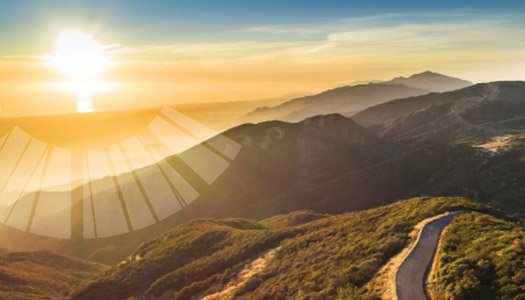 View of the sunset over the mountains and coastline