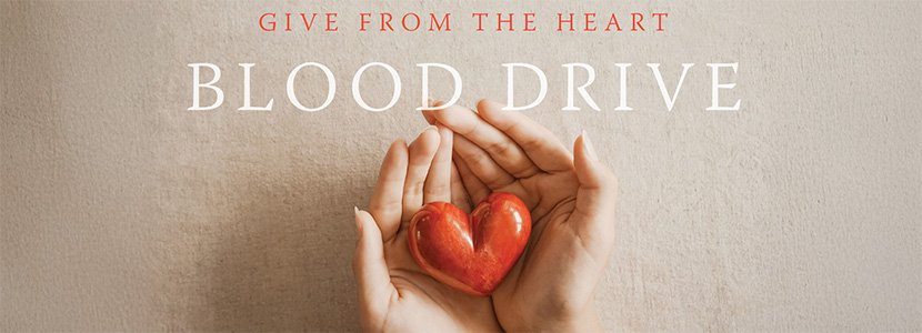 hands holding a ceramic heart, the words give from the heart blood drive overlaid