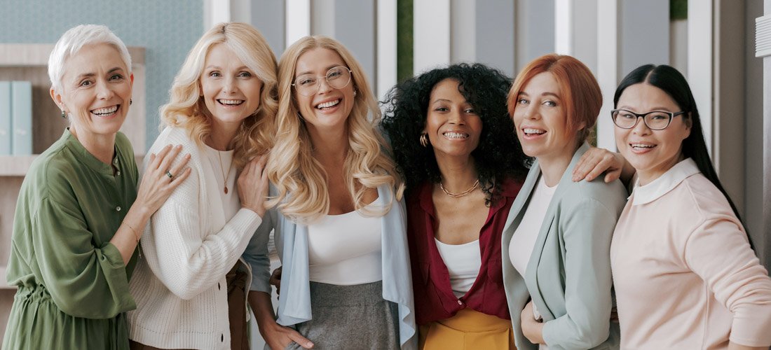 Diverse group of women smiling at the camera