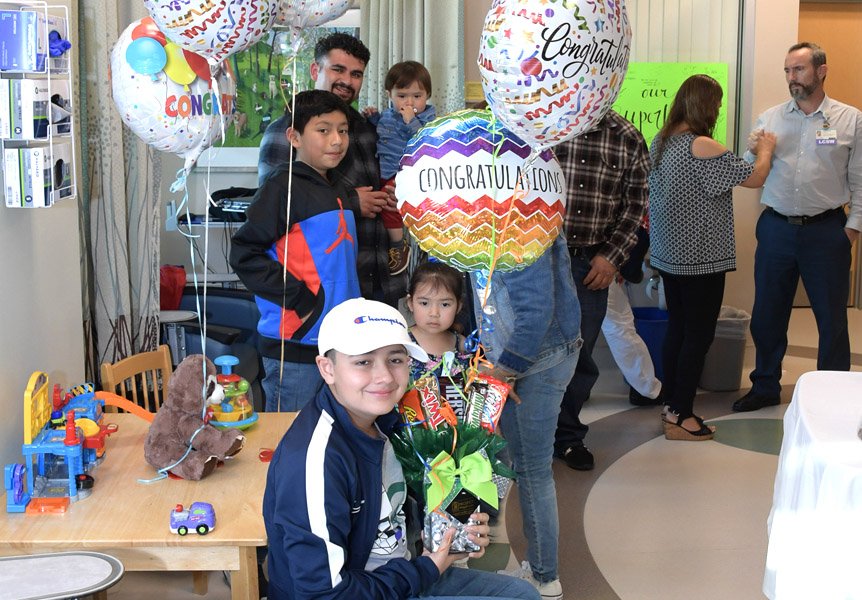 Patient and family celebrating last day of Chemotherapy