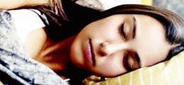 Teen sleeping on a bed