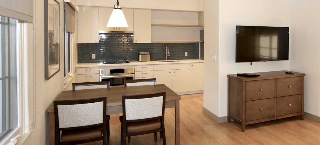 View of the dining room and kitchen at the Cottage Family Suites