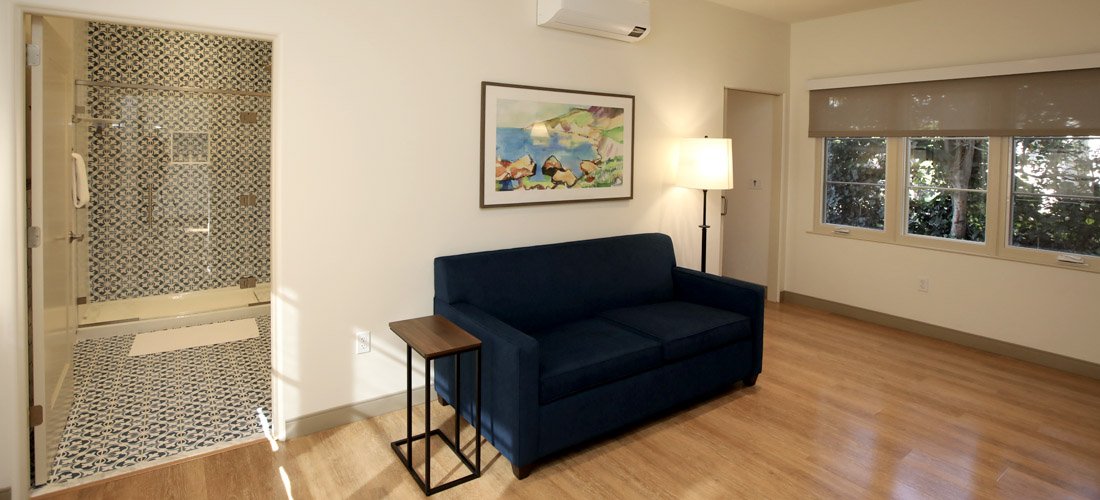 View of the bedroom and bathroom at one of the Cottage Family Suites