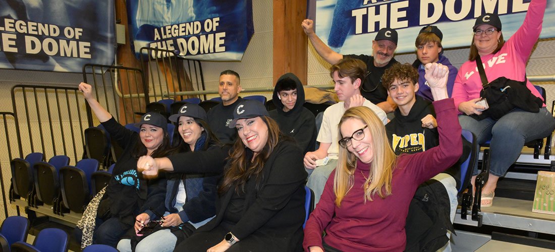 Cottage Employees and family cheering for UCSB in the Thunderdome bleachers
