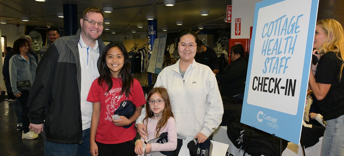 Cottage Employee and family checking in to a UCSB Basketball game