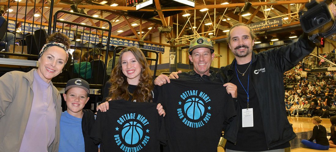 Cottage Employees and family wearing their Cottage Night T-shirts on the court at UCSB