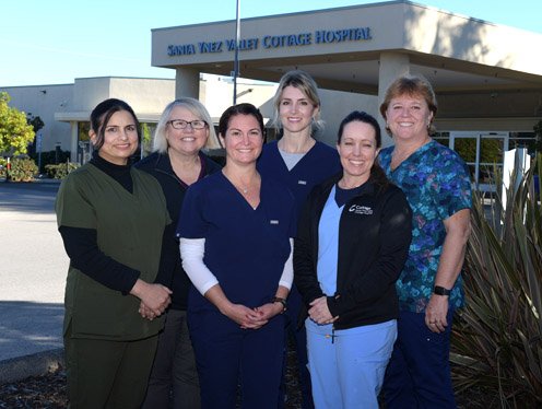 Group of Cottage employees standing in front of Santa Ynez Valley Cottage Hospital