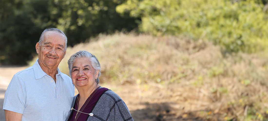 Cottage Heart & Vascular Center Clinics patients standing on a hiking trail and smiling at the camera