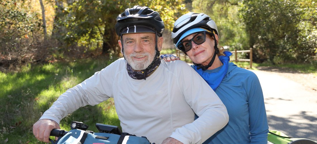 Cottage Heart & Vascular Center patient Patrick Grennen riding a bicycle with his wife