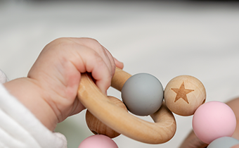 An infant playing with a toy