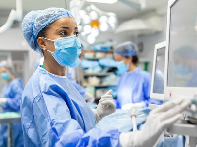 Photo of provider working in an operating room