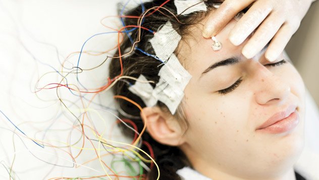 Patient on a table receiving a neurology test