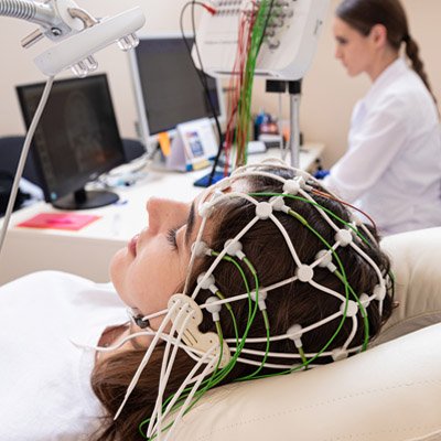 Patient laying on a table getting a brain scan