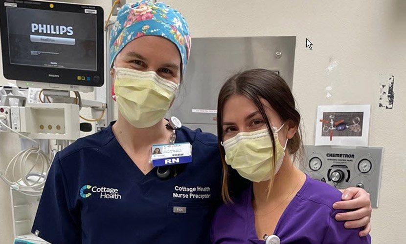 Two Cottage nurses wearing masks looking at the camera