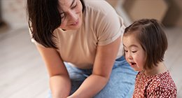 a girl with Down Syndrome and her mother