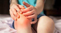 a boy with knee joint pain