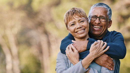 Senior couple smiling at the camera