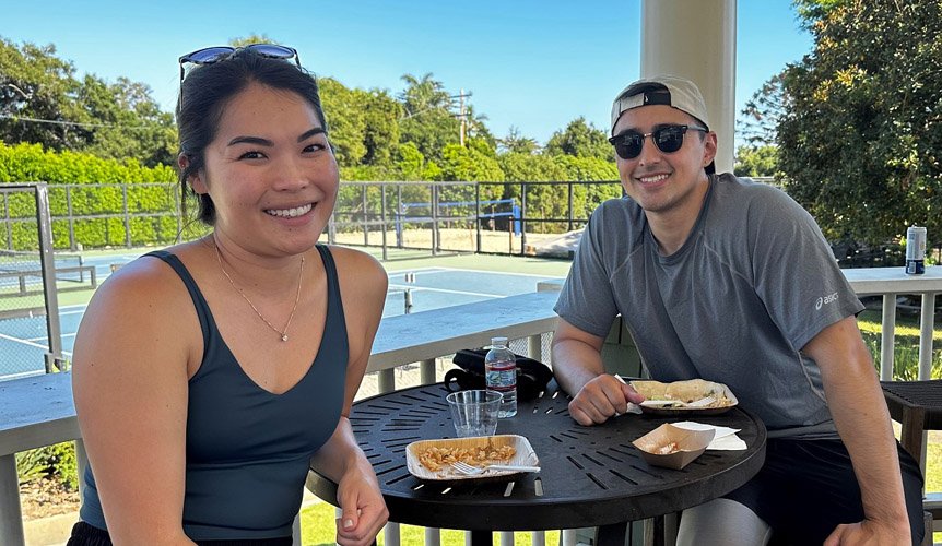 A pair of residents enjoying a day of tennis