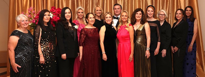 2025 Tiara Ball Committee in front of the Tiara Ball backdrop