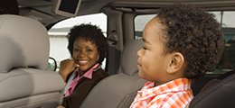 Mother and young child in a rideshare vehicle
